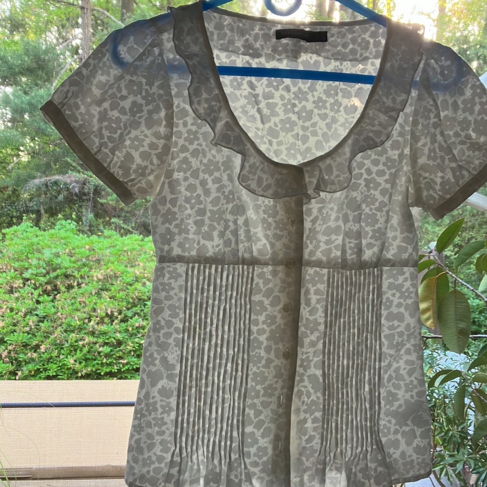 Airy white on white cap sleeved, pleated, button front,ruffled scoopneck top. XS